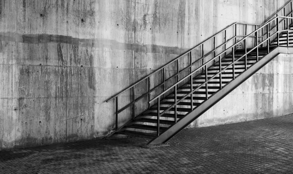 Black,And,White,Old,Metal,Stairs,Of,Concrete,Wall